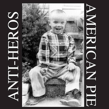 Black and white photo of a child sitting outdoors with 'Anti-Heros American Pie' text on sides.