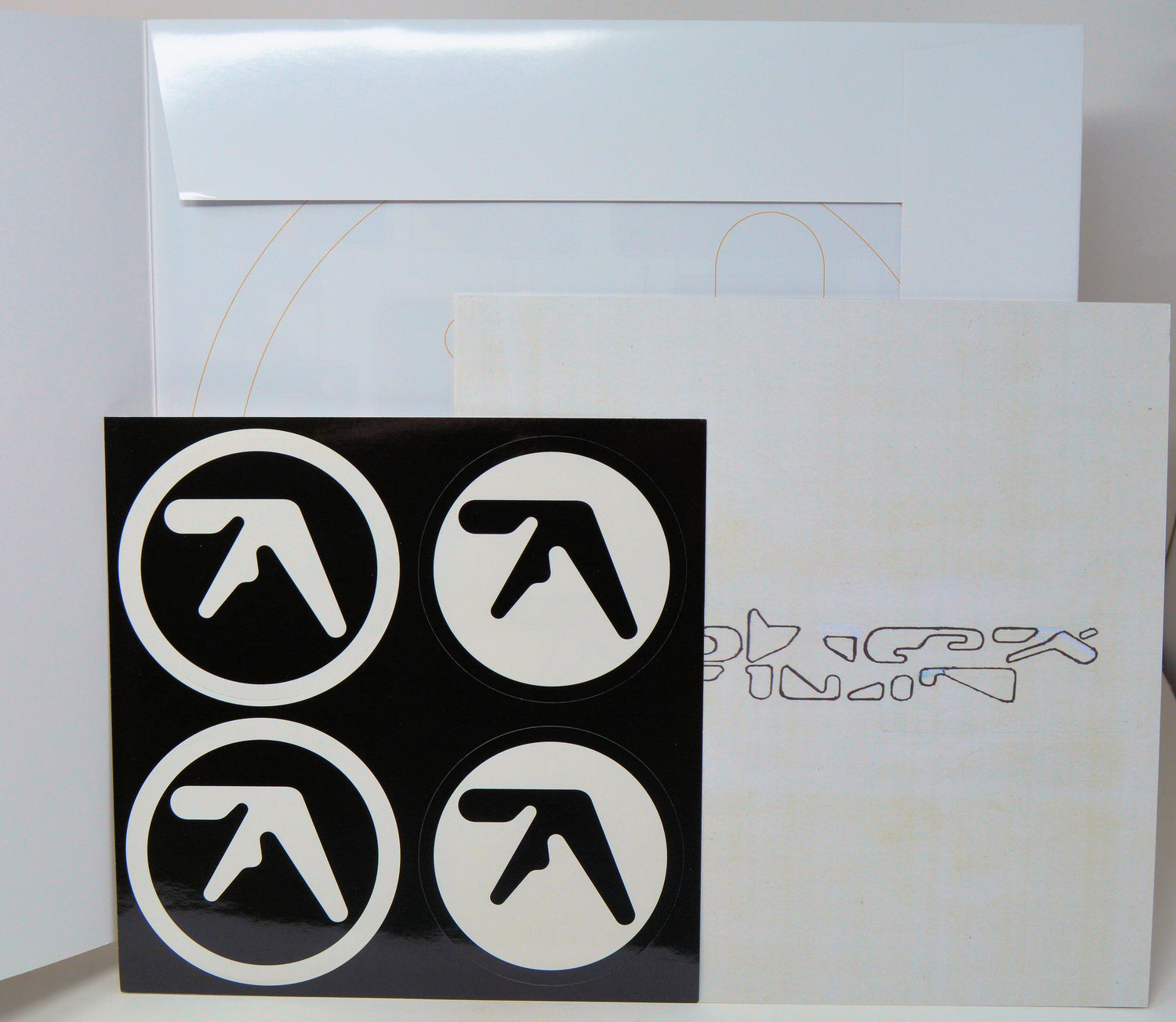 Vinyl record with black and white logo design on a white background