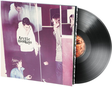 Vinyl record with a purple cover featuring images of people and the band 'Arctic Monkeys' logo.