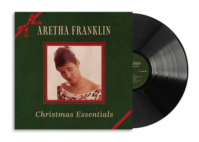 Aretha Franklin 'Christmas Essentials' vinyl record album with the green cover jacket and black record partially visible, on a white background.