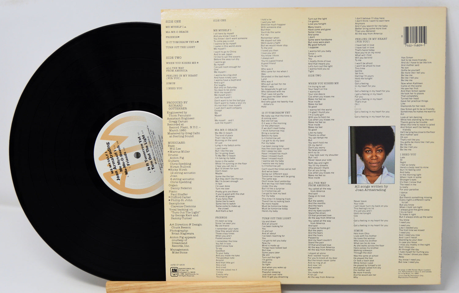 A used vinyl record of Joan Armatrading's album 'Me Myself I' with the artist's photo on the cover, displayed next to the vinyl.