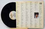 A used vinyl record of Joan Armatrading's album 'Me Myself I' with the artist's photo on the cover, displayed next to the vinyl.