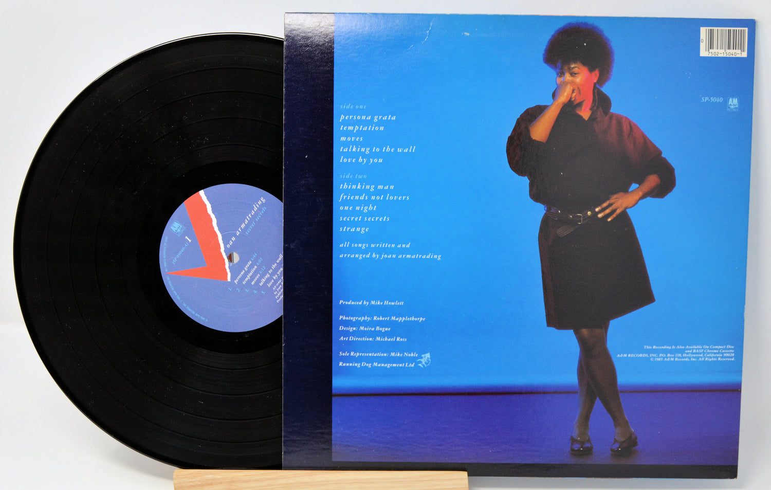 Vinyl record album by Joan Armatrading titled 'Secret Secrets' with a purple and blue cover featuring an image of the artist.