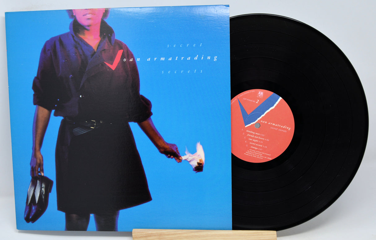 Vinyl record album by Joan Armatrading titled 'Secret Secrets' with a purple and blue cover featuring an image of the artist.