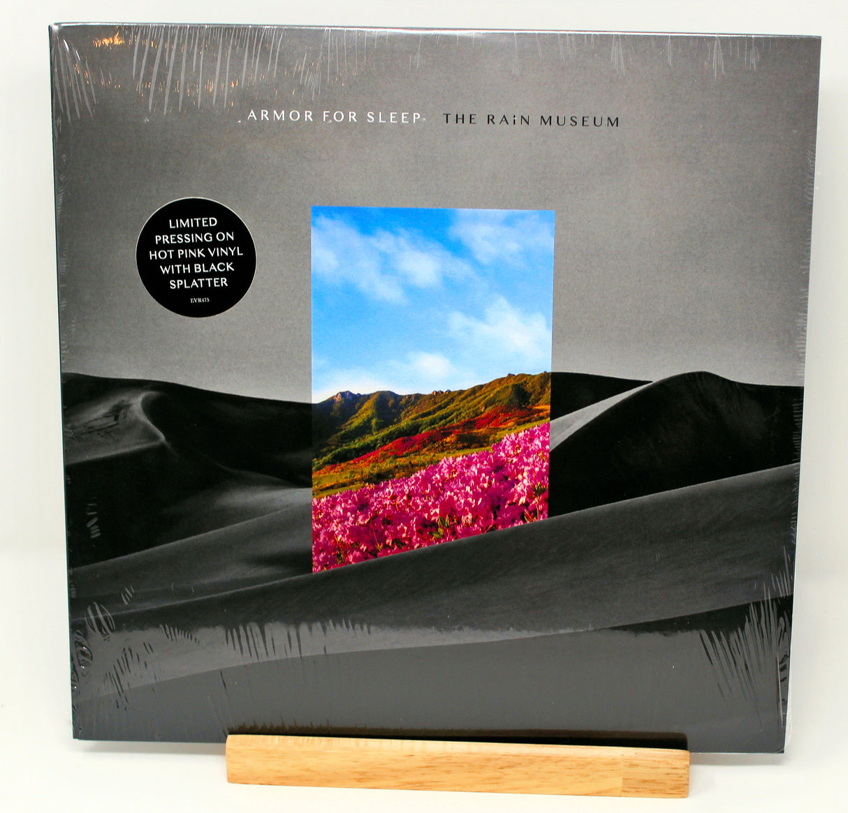 Limited hot pink/black splatter vinyl record album cover for Armor For Sleep - The Rain Museum, with a graphical representation of a desert landscape and pink flowers.