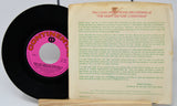 Vinyl record with pink label and record cover featuring text on a white background