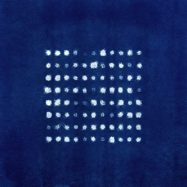 Blue album cover featuring artwork showing white painted dots on a blue background