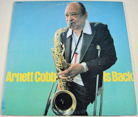 Front cover of 'Arnett Cobb Is Back' vinyl album featuring Arnett Cobb playing saxophone