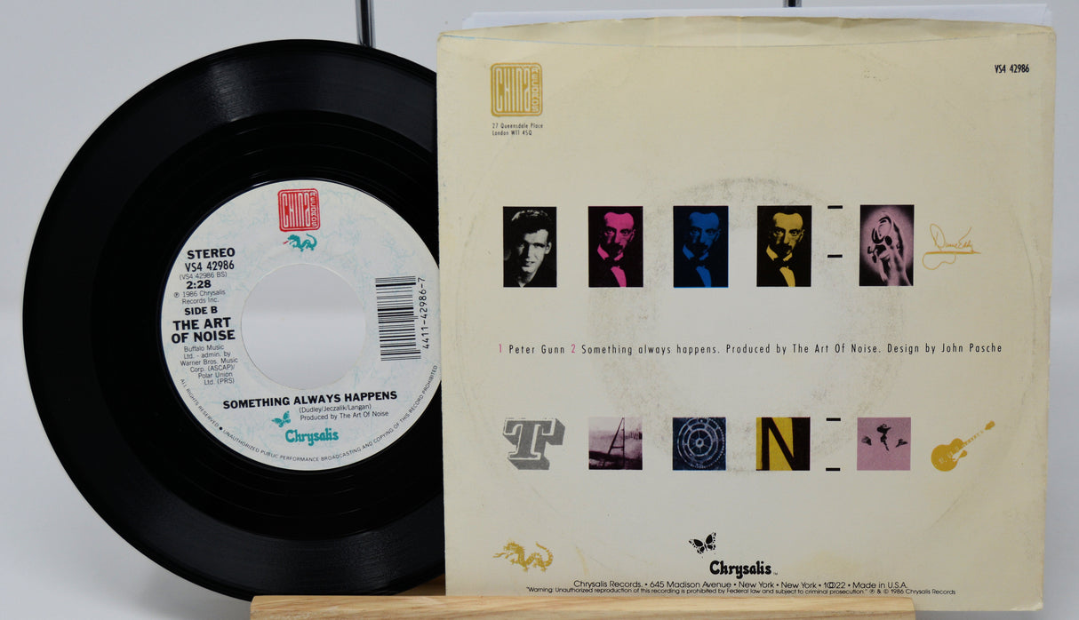Vinyl record and its cover with 'The Art of Noise' design on a white background