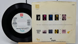 Vinyl record and its cover with 'The Art of Noise' design on a white background