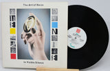 Vinyl record and cover of 'The Art of Noise In Visible Silence' on a white background