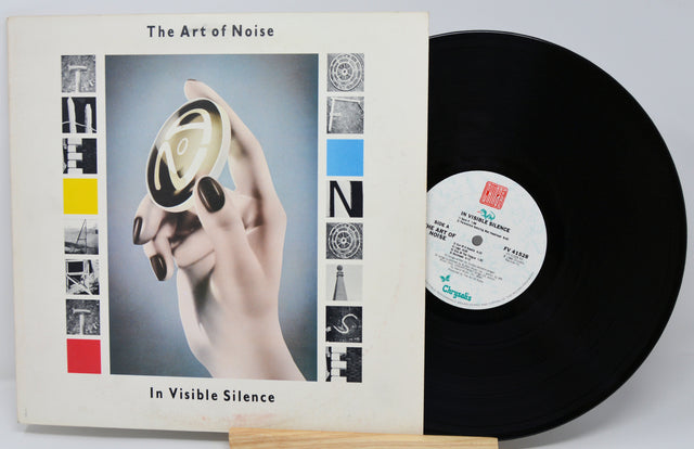 Vinyl record and cover of 'The Art of Noise In Visible Silence' on a white background