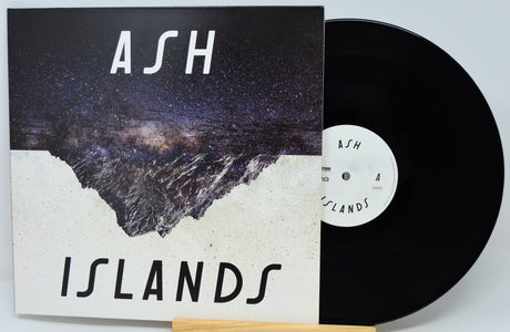 Vinyl record with cover titled 'Islands' by Ash on a light gray background
