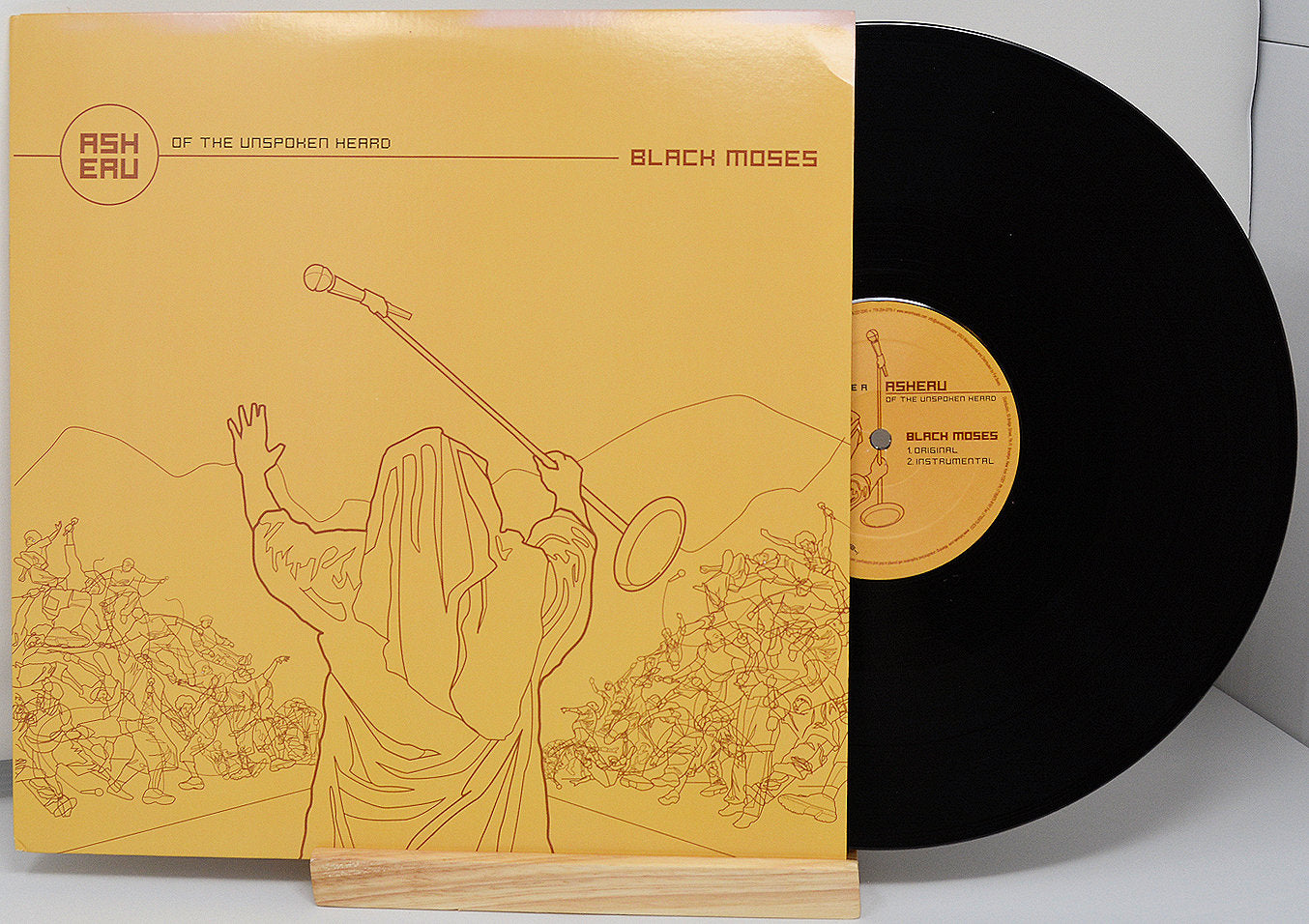 Front cover of Asheru's Black Moses 12-inch vinyl with stylized line art of Moses and crowd
