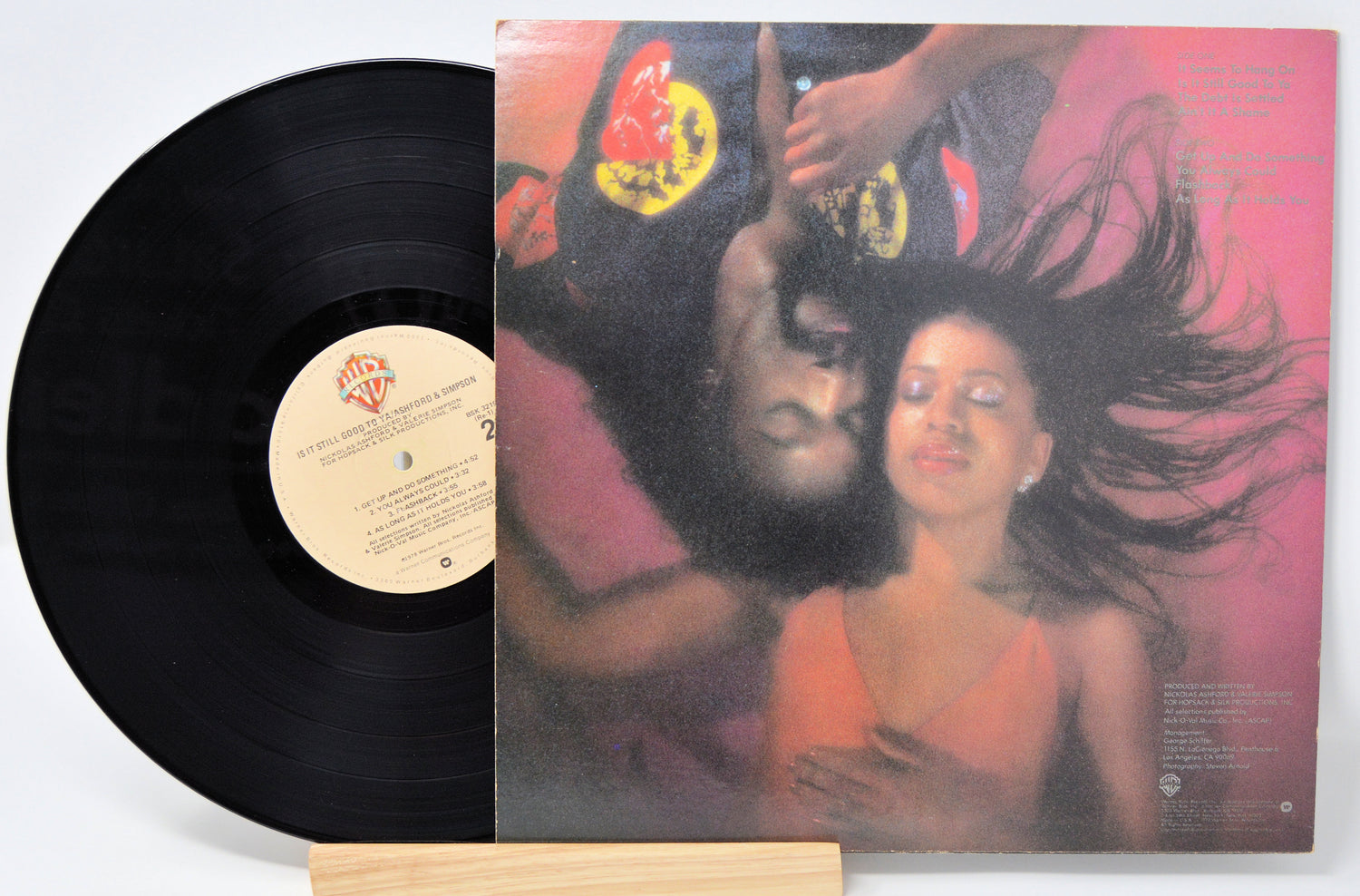 Used vinyl record of Ashford & Simpson with a label showing the title 'Is It Still Good To Ya' and an image of a couple embracing.