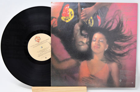 Used vinyl record of Ashford & Simpson with a label showing the title 'Is It Still Good To Ya' and an image of a couple embracing.