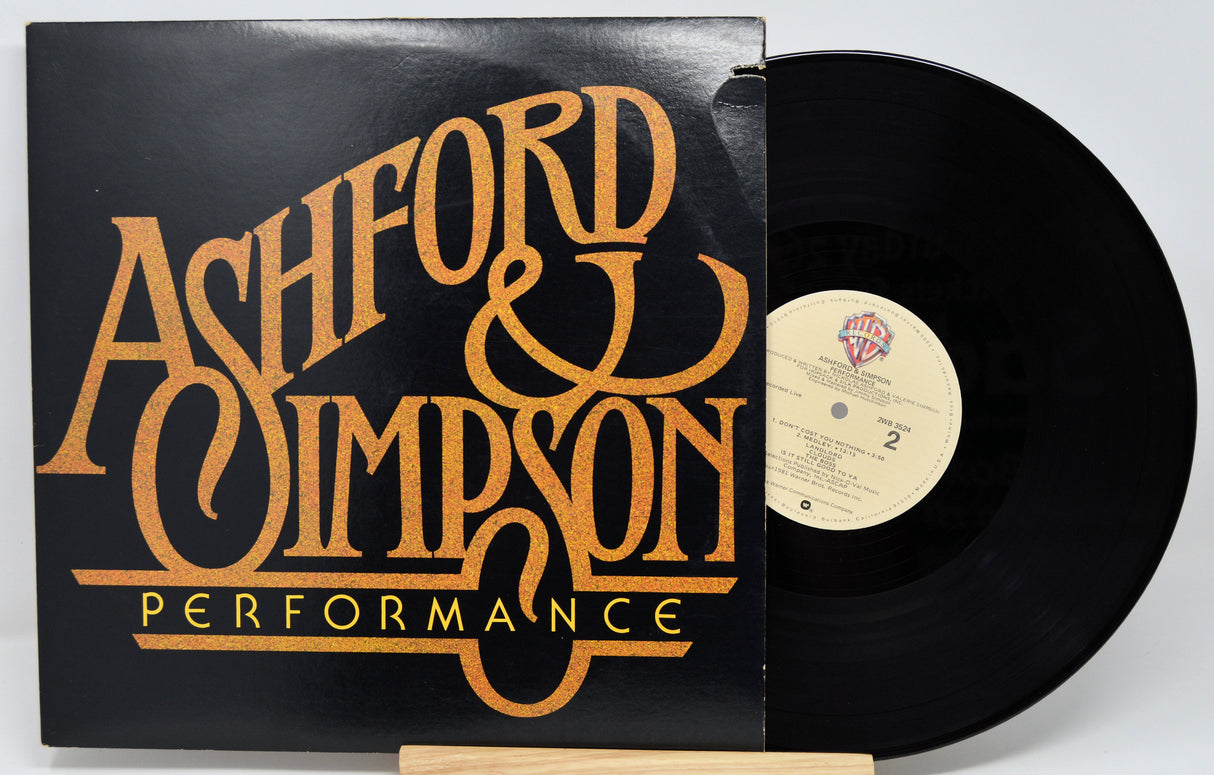 Vinyl record with 'Ashford & Simpson' cover on a white background