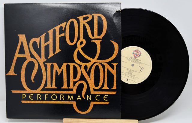 Vinyl record with 'Ashford & Simpson' cover on a white background