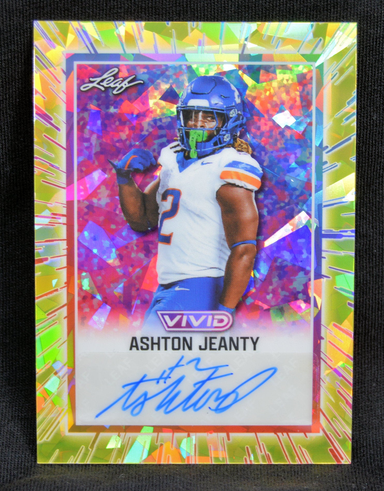 Front of the Leaf Vivid Ashton Jeanty football card with autograph and holographic background