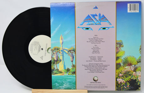 Vinyl record with colorful cover featuring artistic design and text