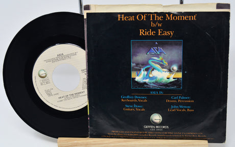 Vinyl record with cover featuring a dragon illustration on a white background