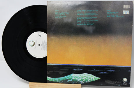 Vinyl record with cover featuring a gradient design and text