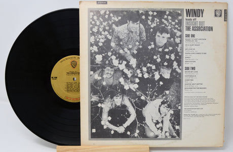 Vinyl record and cover with 'Windy' by The Association on a white background