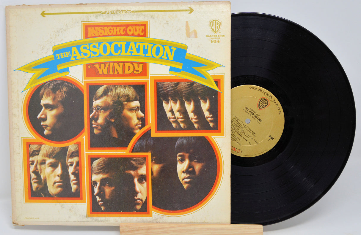 Vinyl record and cover with 'Windy' by The Association on a white background
