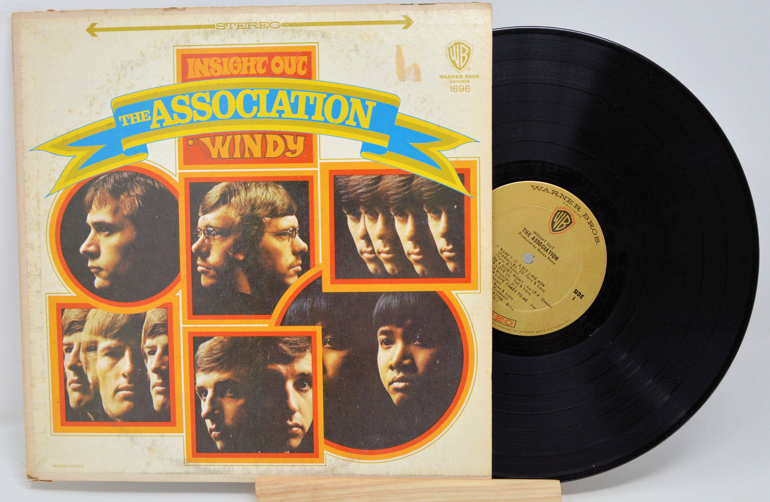Vinyl record and cover with 'Windy' by The Association on a white background