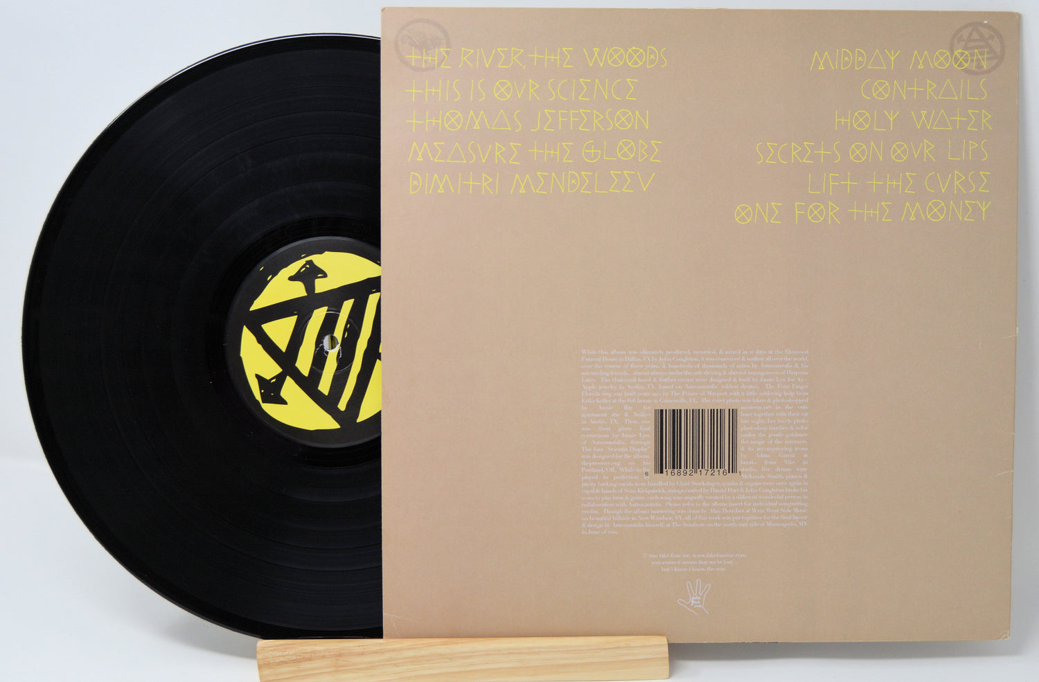 A vinyl record titled 'Astronautalis - This Is Our Science' with a portrait of a man wearing a fantastical, armored costume on the cover.