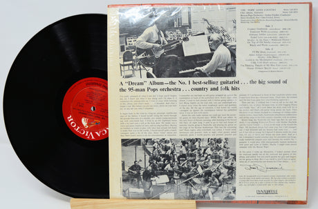 Vinyl record with a detailed record cover featuring black and white images and text.
