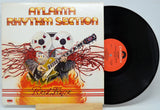 Vinyl record with cover featuring a guitar and reel-to-reel tape, labeled 'Atlanta Rhythm Section' and titled 'Red Tape'.