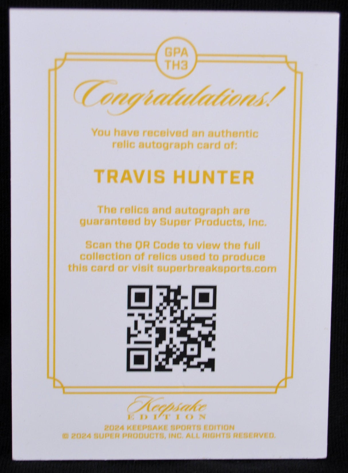 Certificate of authenticity for Travis Hunter relic autograph card with QR code