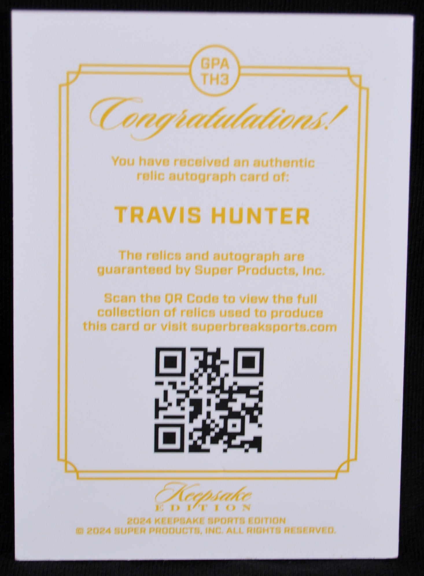 Certificate of authenticity for Travis Hunter relic autograph card with QR code