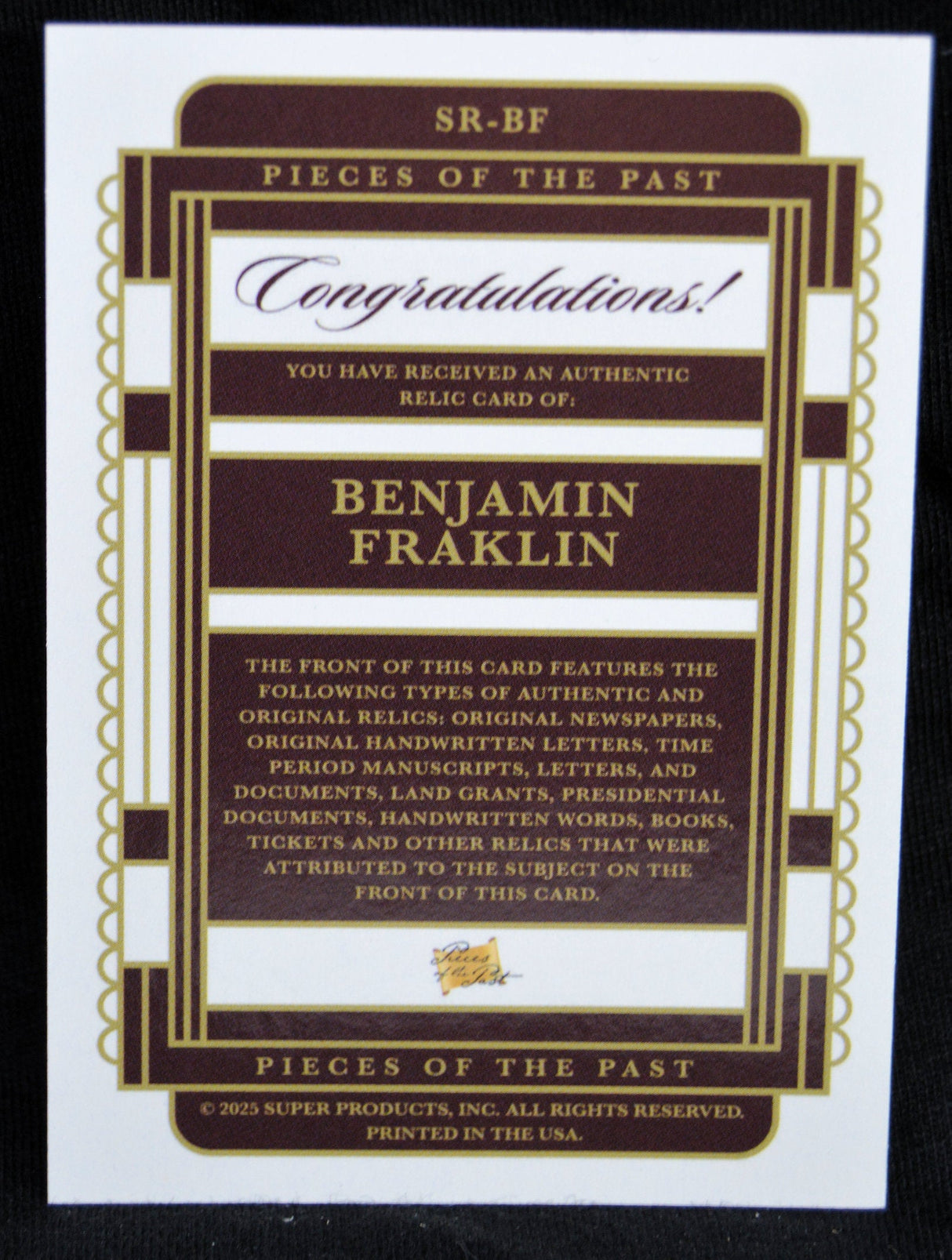 Back of Benjamin Franklin relic card detailing authenticity and relic types
