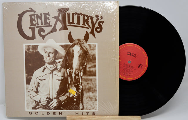 Vinyl record with cover featuring a cowboy and horse, labeled 'Gene Autry's Golden Hits'.
