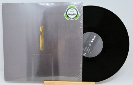 Front cover and black vinyl record of Avatarium's 'The Fire I Long For' LP with gold logo and Nuclear Blast sticker