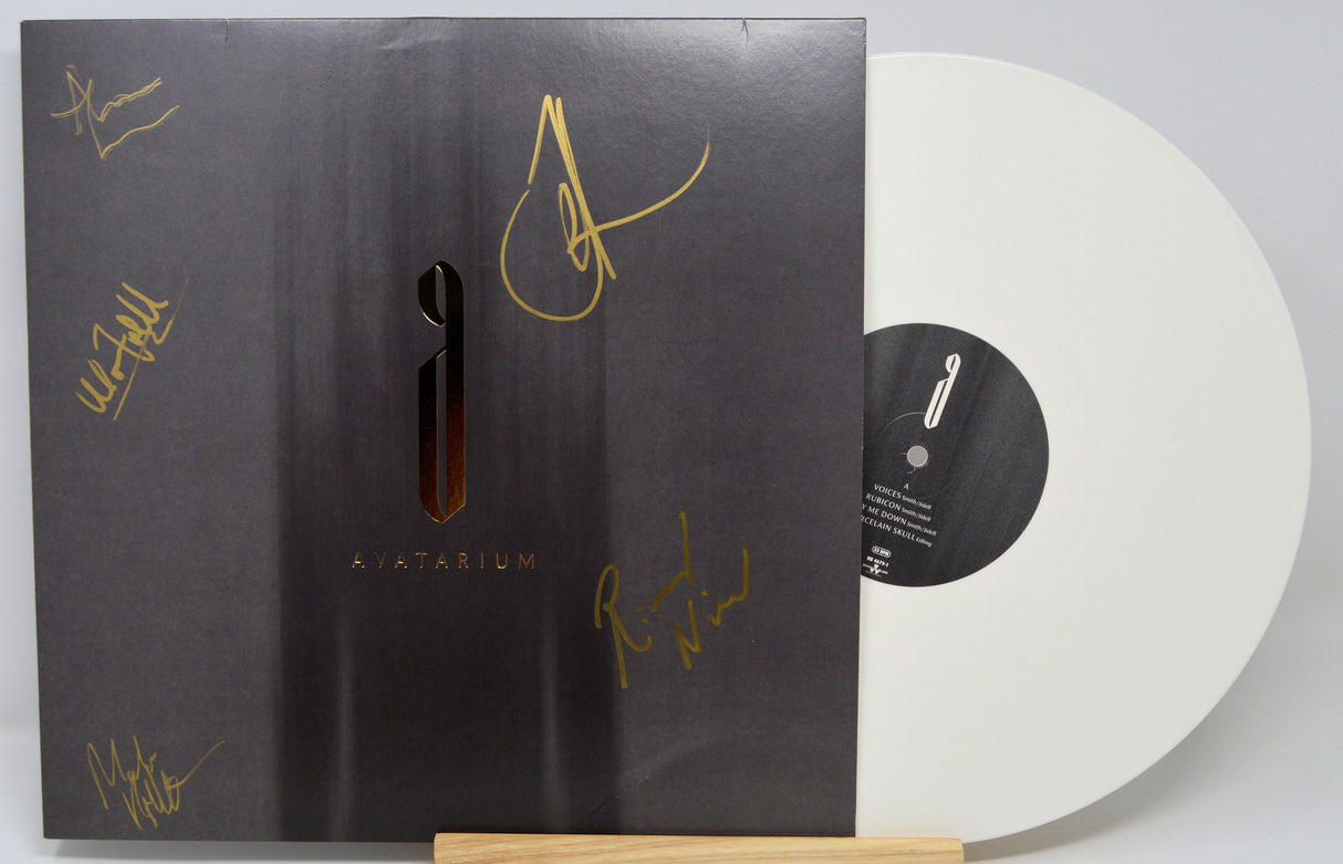 Front cover and white vinyl record of Avatarium's 'The Fire I Long For' LP with gold member autographs