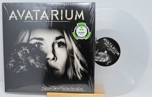 Front cover and clear vinyl record of Avatarium's The Girl With The Raven Mask limited edition LP