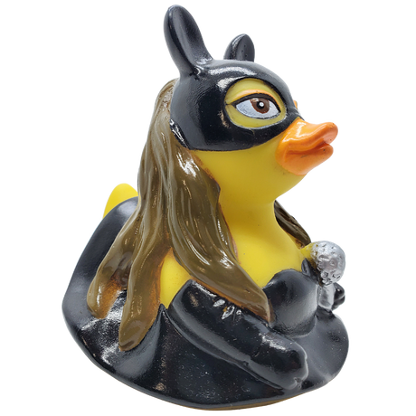 Yellow rubber duck with a superhero mask and cape on a white background