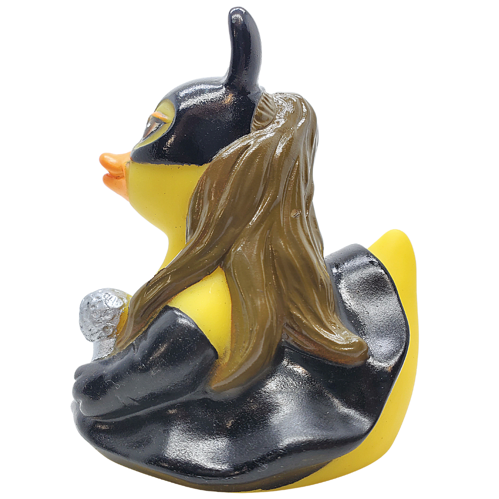 Rubber duck with long hair and black outfit on a white background