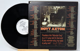 A vinyl record titled 'Hoyt Axton - Fearless' with the artist's image on the cover.