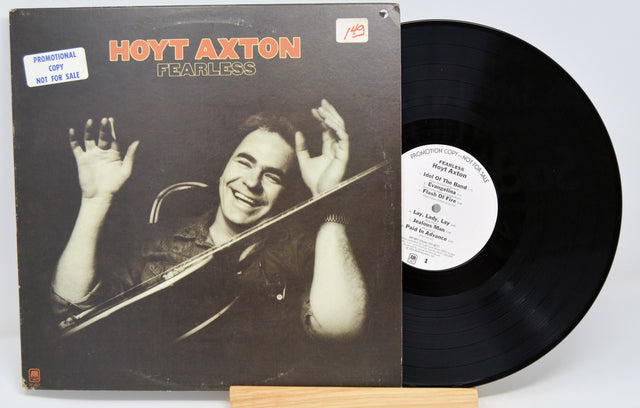 A vinyl record titled 'Hoyt Axton - Fearless' with the artist's image on the cover.