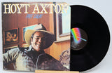 Vinyl record with cover featuring a person wearing a cowboy hat, titled 'Free Salin' by Hoyt Axton.
