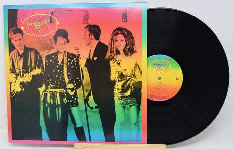 Vinyl record with a colorful cover featuring a band and a visible record label.
