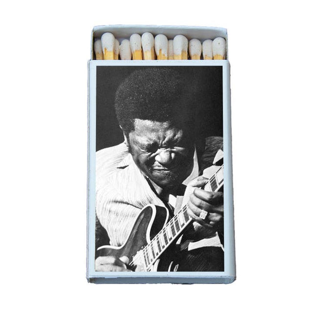 Matchbox with black and white photo of soulful blues guitarist playing electric guitar