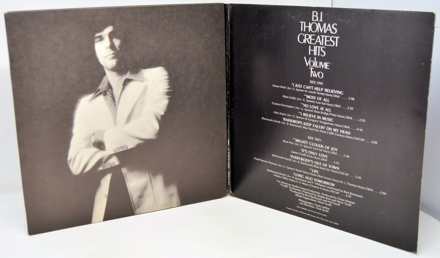 Album cover for B.J. Thomas' 'Greatest Hits Volume Two' with a portrait on the left and tracklist on the right.