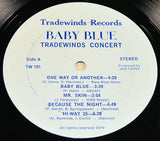 Close-up of Baby Blue Tradewinds Concert album vinyl label with song list and credits