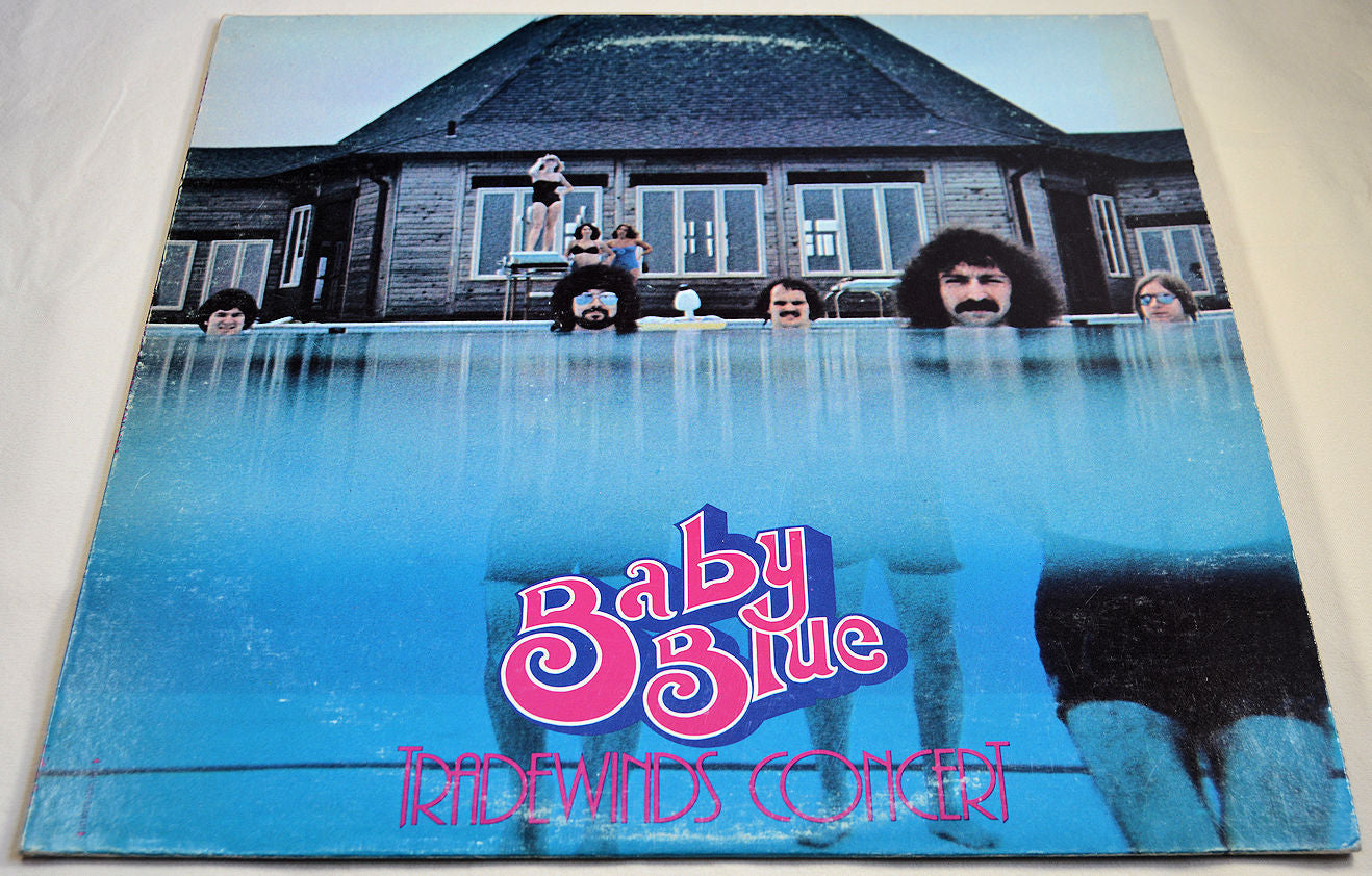 Front cover of Baby Blue Tradewinds Concert album showing band members in a pool