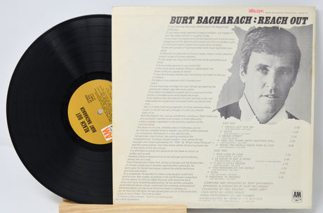Vinyl record with cover featuring Burt Bacharach's 'Reach Out' on a light gray background